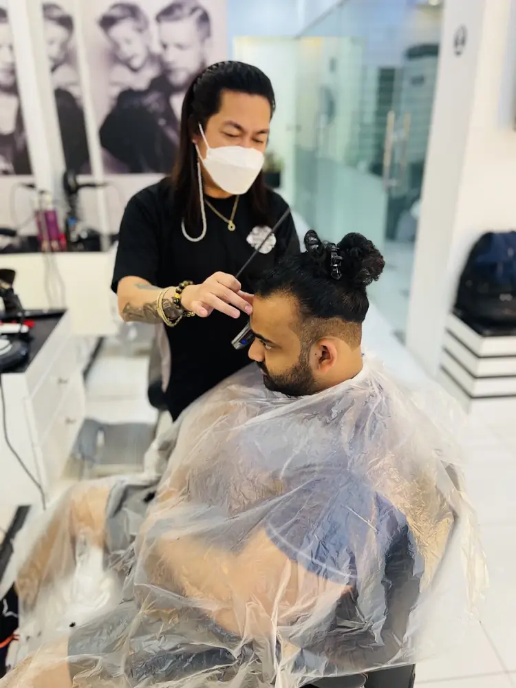 Stylist working on a client at Groom Studio